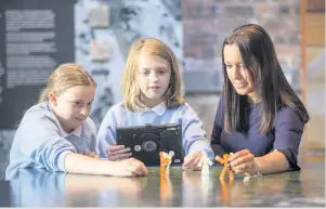  ??  ?? Digital future Pupils Elizabeth Newbie and Lily Hanisek with Mrs Gemmell Getting technical