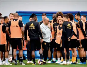  ?? AFP ?? Belgium’s coach Roberto Martinez (centre in light grey jersey) speaks to his players during a training session at the Guchkovo Stadium in Dedovsk, outside Moscow on Monday. —