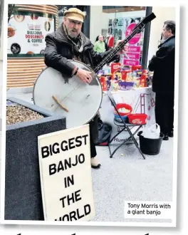  ??  ?? Tony Morris with a giant banjo