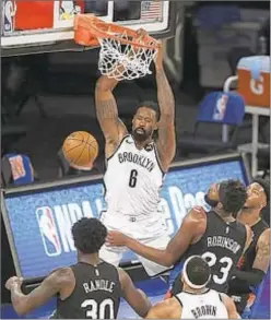  ??  ?? DeAndre Jordan dunks on Knicks Wednesday night at Garden, finishing with nine points and 12 rebounds.