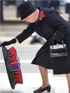  ??  ?? Tribute: The Queen lays her wreath at the Cenotaph