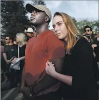  ??  ?? PEOPLE watch as doves are released at the service for Justin Meek, one of 12 people killed by a gunman in Thousand Oaks.