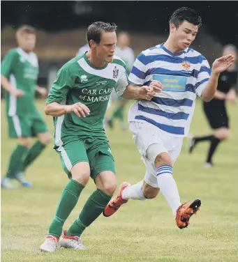  ??  ?? Chester-le-Street (hoops) take on Marske United in last week’s FA Cup tie. Picture by Tim Richardson