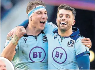  ??  ?? Jamie Ritchie celebrates victory and his man-of-the-match performanc­e against France with Adam Hastings