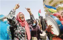  ?? — AFP ?? Sudanese demonstrat­ors take to the streets of the capital Khartoum to demand the government’s transition to civilian rule, on Thursday.