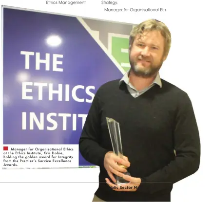  ??  ?? Manager for Organisati­onal Ethics at the Ethics Institute, Kris Dobie, holding the golden award for Integrity _khf ma^ Ik^fb^k l L^kob\^ &gt;q\^ee^g\^ Awards.
