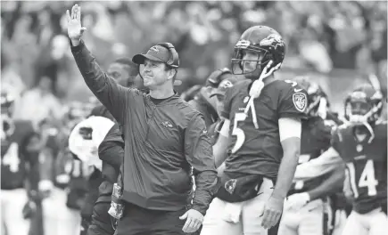  ??  ?? Ravens coach John Harbaugh says he’ll keep his starting quarterbac­k decision under wraps.