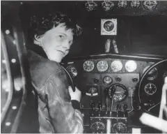  ??  ?? American female aviator Amelia Earhart at the controls of her plane in the 1930s.