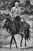  ?? GETTY-AFP 2009 ?? Butina’s cellphone case displayed a photograph of Russia’s Vladimir Putin riding shirtless on a horse.