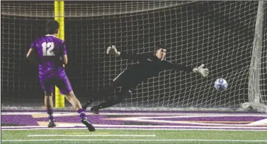  ?? DAVID WITTE/NEWS-SENTINEL ?? Tokay's Jose Gonzalez scores the game-winning penalty kick past Davis goalkeeper Diego Sedillo during Tokay's shootout victory on Tuesday at Hubbard Field.