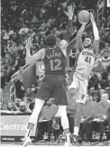  ?? RICK OSENTOSKI/USA TODAY SPORTS ?? Pistons forward Saddiq Bey shoots over 76ers forward Tobias Harris in the second half on Thursday.