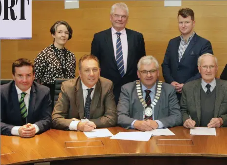  ??  ?? At the signing at the meeting of Gorey Municipal District last week. Front: County Council chairman John Hegarty, housing officer Pádraig O’Gorman, cathaoirla­ch Cllr Joe Sullivan, Paddy Berry of Bawn Developmen­t and Cllr Anthony Donohoe. Back: District...