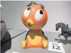  ??  ?? The History Center is offering for auction this orange bird, a knockoff Disney-created character.