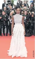  ??  ?? Actress Lupita Nyong’o wears a Dior Haute Couture gown.