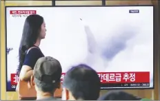  ?? AP PHOTO/AHN YOUNG-JOON ?? A TV screen shows a file image of North Korea’s missile launch during a news program at the Seoul Railway Station in Seoul, South Korea, on Wednesday.