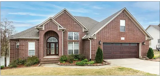  ?? SUBMITTED PHOTOS ?? This four-bedroom, three-bath, two-story home in Cabot features ornate architectu­ral details, water views and a covered deck.