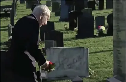  ??  ?? LOVE FOR A FRIEND: Douglas Newham, 98, lays a wreath at his comrade’s memorial last week