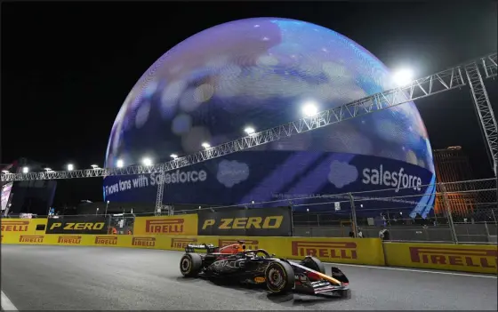  ?? NICK DIDLICK — THE ASSOCIATED PRESS ?? Max Verstappen passes by the Sphere as he leads the race during the Formula One Las Vegas Grand Prix on Saturday night.