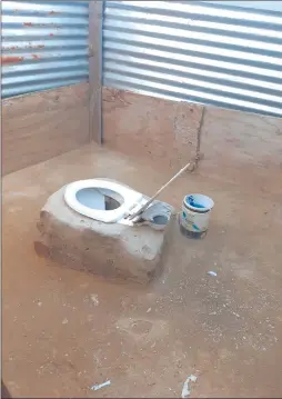  ?? Photo: Festus Hamalwa ?? Privacy compromise­d… The toilet that is used by 45 households at Havana’s Oohambo dhaNehale location in Windhoek.