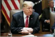  ?? EVAN VUCCI — THE ASSOCIATED PRESS ?? President Donald Trump listens to a question Tuesday during a cabinet meeting at the White House in Washington.