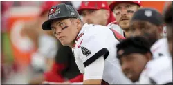  ?? ALEX MENENDEZ — THE ASSOCIATED PRESS ?? Tampa Bay quarterbac­k Tom Brady watches action from the bench during Sunday’s game against Carolina.