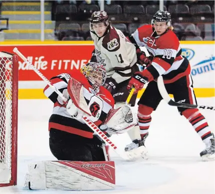  ?? CLIFFORD SKARSTEDT EXAMINER FILE PHOTO ?? The Peterborou­gh Petes moved Wednesday to fill their vacant third overager position, acquiring veteran Ottawa 67’s defenceman Hudson Wilson through a trade. Wilson, right, is seen in action Dec. 8, 2016 at the Memorial Centre, jostling with Zach Gallant.