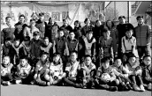  ?? PROVIDED TO CHINA DAILY ?? Zhang Lu (back row, fourth from left) poses with youngsters after a charity activity at a primary school in Hedong district, Tianjin, last November.