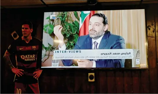 ??  ?? Lebanon’s recently resigned prime minister Saad al-Hariri is seen at a Future television interview in Saudi Arabia, at a coffee shop in Beirut, Lebanon on Sunday.