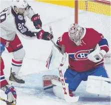  ?? AP PHOTO ?? ZERO TOLERANCE: The Canadiens’ Carey Price makes a stop on the Blue Jackets’ Sam Gagner last night. Price had the shutout in Montreal’s 1-0 overtime victory.