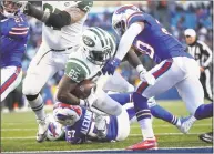  ?? Tom Szczerbows­ki / Getty Images ?? Elijah McGuire of the Jets runs into the end zone to score the eventual winning touchdown late in the fourth quarter against the Bills on Sunday in Buffalo, N.Y.
