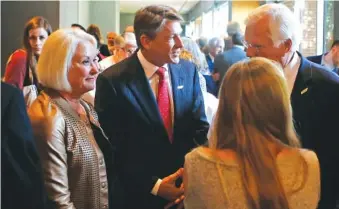  ?? STAFF FILE PHOTO BY C.B. SCHMELTER ?? Gubernator­ial candidate Randy Boyd, center, mingles April 27 during the Hamilton County Republican Party’s Lincoln Day Dinner.