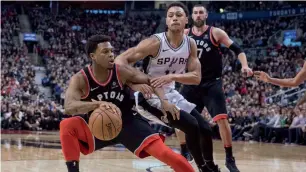  ?? AP ?? Kyle Lowry (left) scored 24 points as Toronto Raptors defeated San Antonio Spurs. —