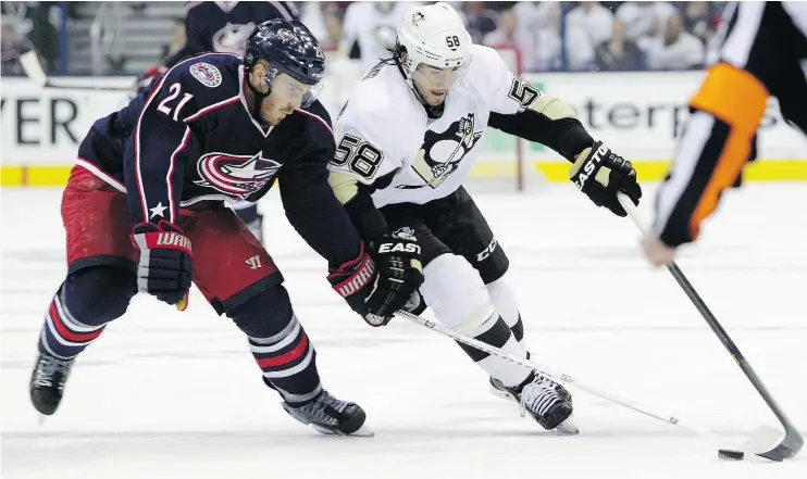  ?? — AP FILES ?? Former Columbus Blue Jackets defenceman James Wisniewski, left, is hoping to get another chance in the NHL, perhaps as a call-up by the St. Louis Blues.