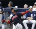  ?? ROSS D. FRANKLIN — THE ASSOCIATED PRESS ?? The Indians’ Francisco Lindor hits a fly ball during the third inning of a spring training game against the Padres on March 10 in Peoria, Ariz.