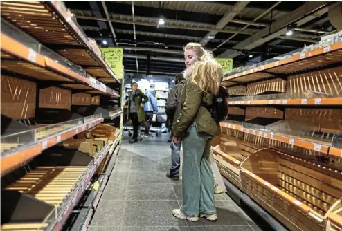  ?? Picture: Carlos Barria/Reuters ?? Customers returned to shops in the Ukrainian capital, Kyiv, this week after a curfew was lifted, but the shelves were largely bare.