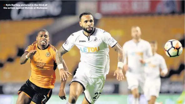  ??  ?? > Kyle Bartley, pictured in the thick of the action against Wolves at Molineux