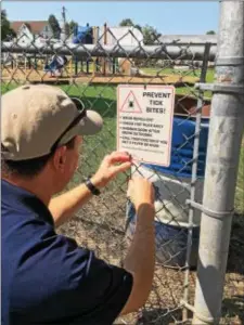  ??  ?? Informatio­nal signs on tick bites have been posted at 40 parks around Upper Darby and Lansdowne.