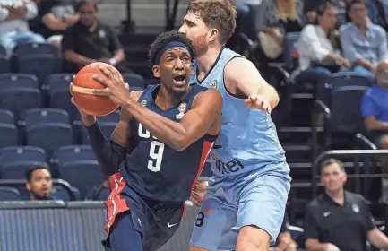  ?? DANTE FERNANDEZ/AFP VIA GETTY IMAGES ?? Uruguay’s Martin Rojas guards the United States’ Langston Galloway during their FIBA Basketball World Cup 2023 Americas Qualifiers game in Montevideo, Uruguay, on Thursday. USA won 88-77.