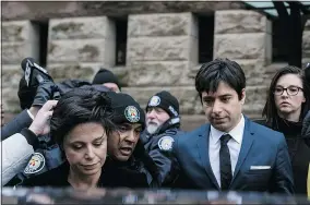  ?? — THE CANADIAN PRESS ?? Jian Ghomeshi leaves court in Toronto on Thursday with his lawyer, Marie Henein, after being acquitted of sex crimes.