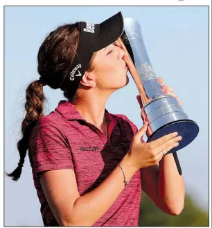  ?? AP/RICHARD SELLERS ?? England’s Georgia Hall defeated Pornanong Phatlum to win the Women’s British Open by two strokes at the Royal Lytham and St. Anne’s Golf Club in Lytham St. Annes, England, on Sunday.