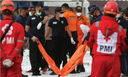  ?? Photograph: Anadolu Agency/Getty ?? Navy members and rescue officers at the crisis centre at Tanjung Priok port in Jakarta, Indonesia.