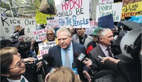  ?? AARON VINCENT ELKAIM/THE CANADIAN PRESS ?? Ontario PC Leader Doug Ford joined protesters Tuesday outside Hydro One’s AGM in Toronto.