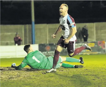  ??  ?? ■ David Foley celebrates equalising against Lancaster