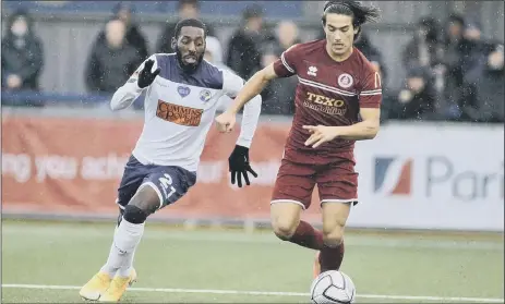  ?? Picture: Kieron Louloudis ?? BACK IN THE STARTING XI
Roarie Deacon, left, in action during the win against Chelmsford