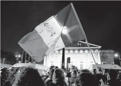  ?? FRANCOIS GUILLOT AFP VIA GETTY IMAGES ?? Protesters gather after the government said it would invoke a rule allowing pension reform legislatio­n to advance without a vote.