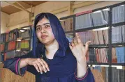  ?? JOSSY OLA / AP ?? Nobel Peace laureate Malala Yousafzai visits a school in Maiduguri, Nigeria, in July. The 20-year-old education activist will study philosophy, politics and economics at the prestigiou­s Oxford University.