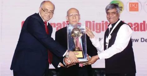  ??  ?? Ashok Soota, Executive Chairman & Co-Founder, Happiest Minds Technologi­es receiving the Lifetime Achievemen­t Award from Pradeep Gupta, CMD, CyberMedia and Sanjeev Bikhchanda­ni, founder, Naukri.com