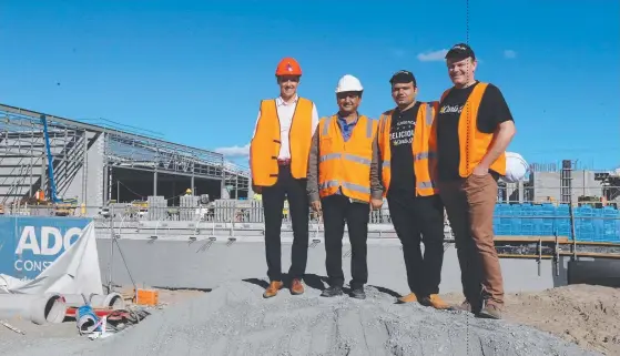  ??  ?? Fast-food outlet Carl Jr is opening at Hope Island Marketplac­e. From left are CBRE’s Rudi Scutti, and Bansal Group’s Premnath and Gaurav Bansal and Shawn Kerr.