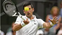  ?? AP ?? Serbia’s Novak Djokovic returns to Korea’s Kwon Soonwoo on day one of the Wimbledon championsh­ips in London, Monday.