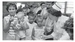  ?? AP ?? Taking oral polio vaccine in Richardson, Texas, in 1962.